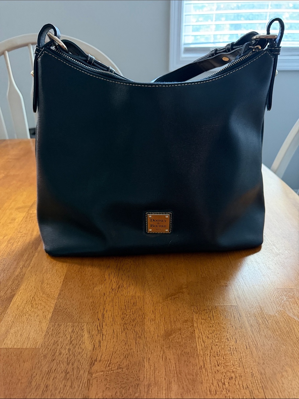 Dooney & Bourke Black Leather Shoulder Bag with Gold Logo Plaque